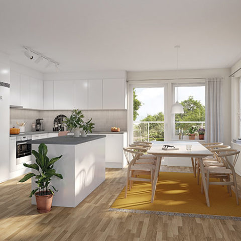 Ett kök med öppen planlösning och en köksö