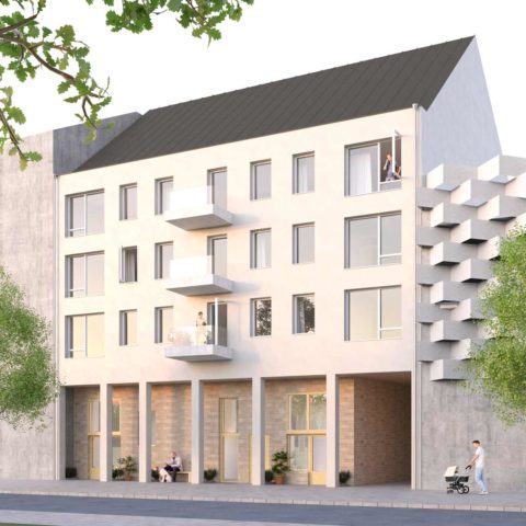 Ett bostadshus på 4 våningar i ljus puts