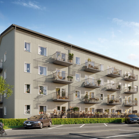 Flerfamiljshus med vit träfasad, altan och balkonger mot parkeringsplats i storfågeln skellefteå