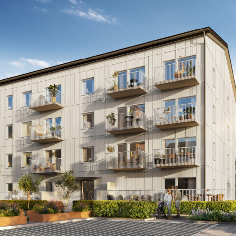 Entrén på en flerfamiljsfastighet i Storfågeln skellefteå med vit träfasad, bakonger och pllanteringar