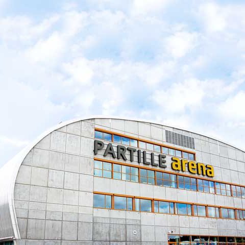 En bild på ett hus som det står Partille arena på