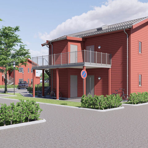 Ett rött hus på två våningar med en stor balkong