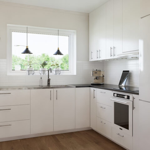 Ett vitt ök med ett fönster ovanför köksbänken