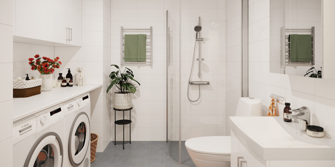 Ett vitt badrum med grått golv. En duschvägg i glas, en tvätt- och torktumlare.
