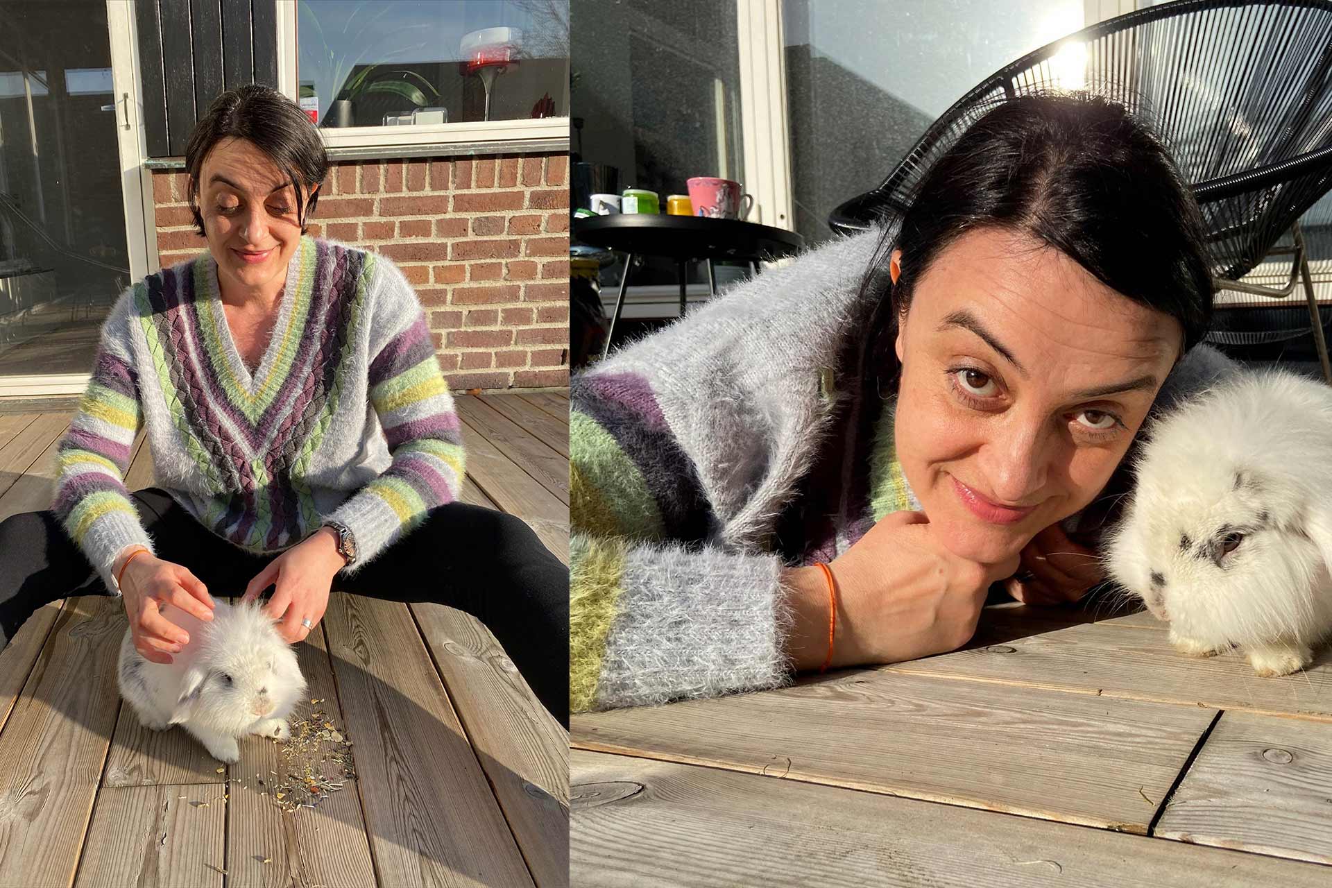 En kvinna gosar med sin kanin ute på terrassen