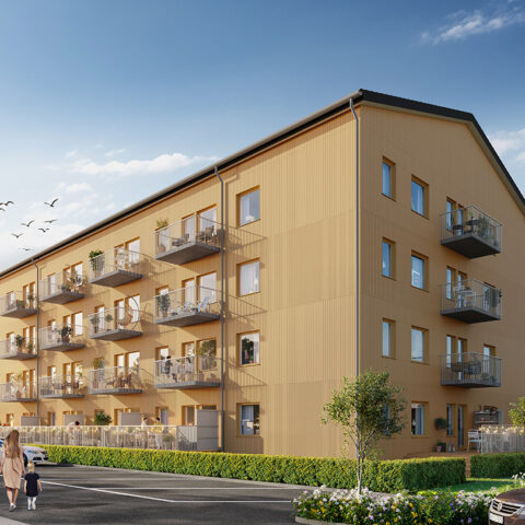 Det gulmålade Hus B i Storfågeln med balkong mot Parkering