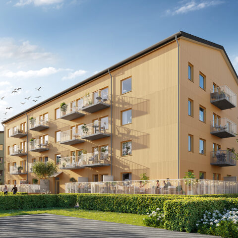 Det gulmålade Hus B i Storfågeln med balkong mot innergården.